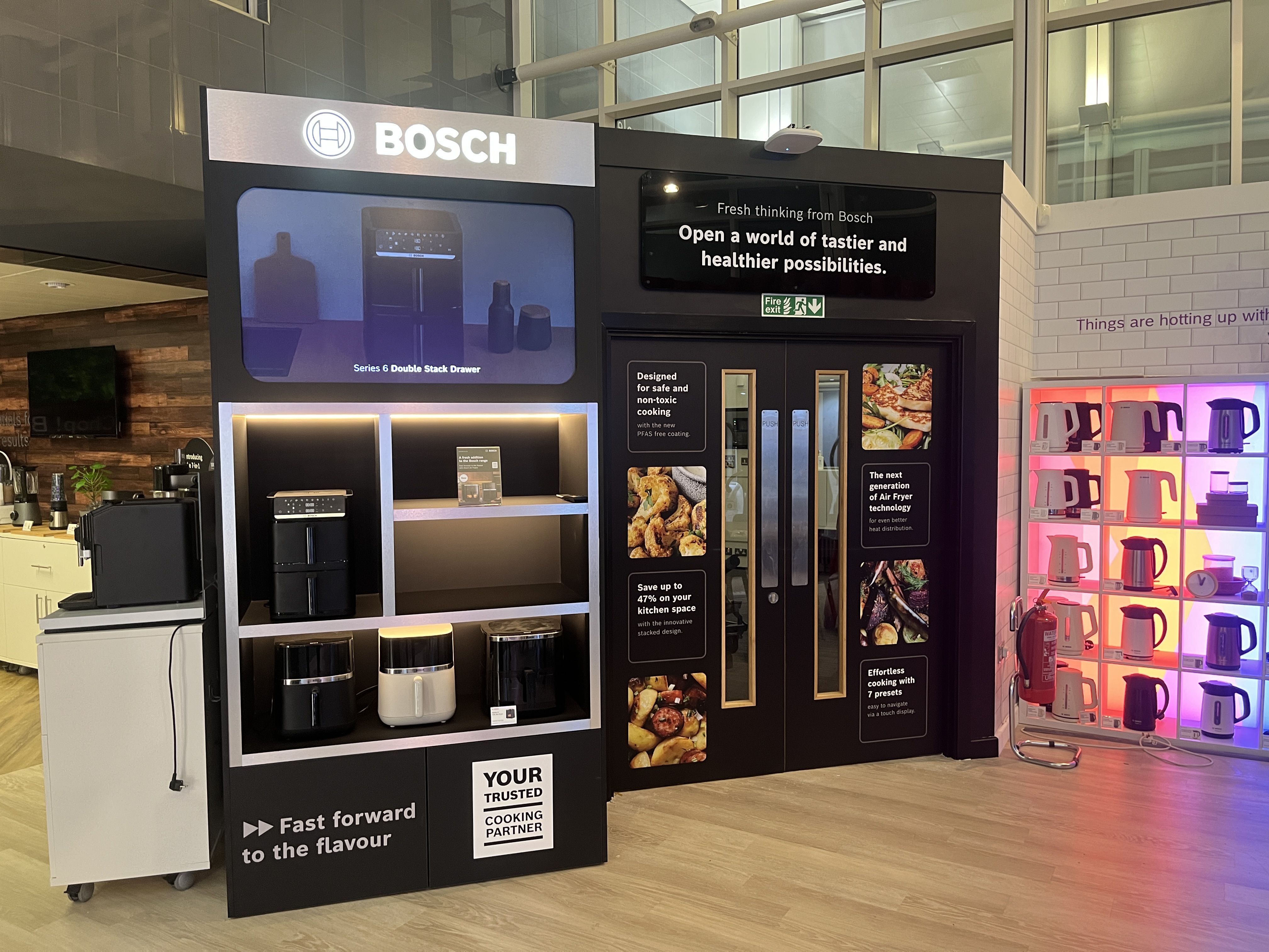 Bosch Airfryer product showcase at BSH HQ with branded graphics, product shelving and illuminated signage